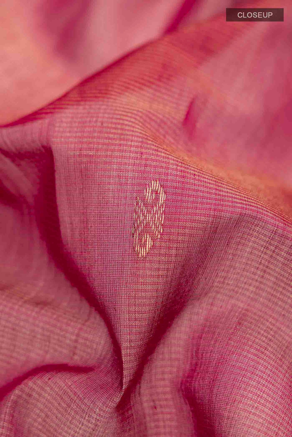 Close up of Maroon Maheshwari Silk Saree with Zari Butta on the body and Zari Border displaying folds