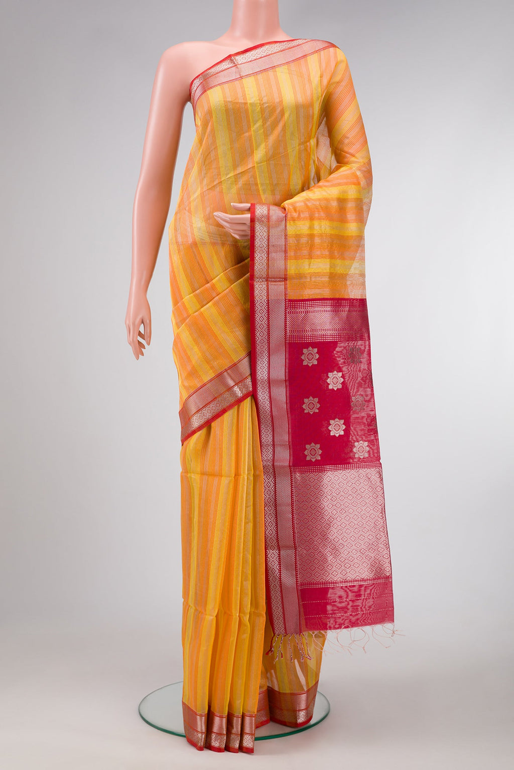 Orange and Yellow Color Maheshwari Silk Saree with Stripes on the body and Zari Border.  displayed on a mannequin