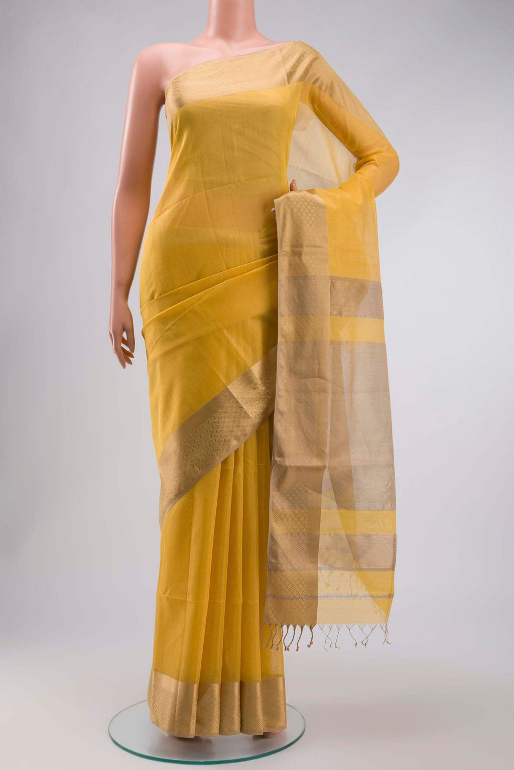 Yellow Maheshwari Silk Saree with Plain Body and Zari Border displayed on a mannequin