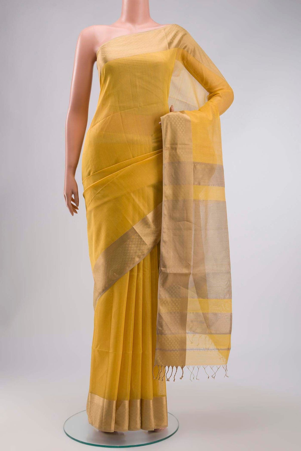 Yellow Maheshwari Silk Saree with Plain Body and Zari Border displayed on a mannequin