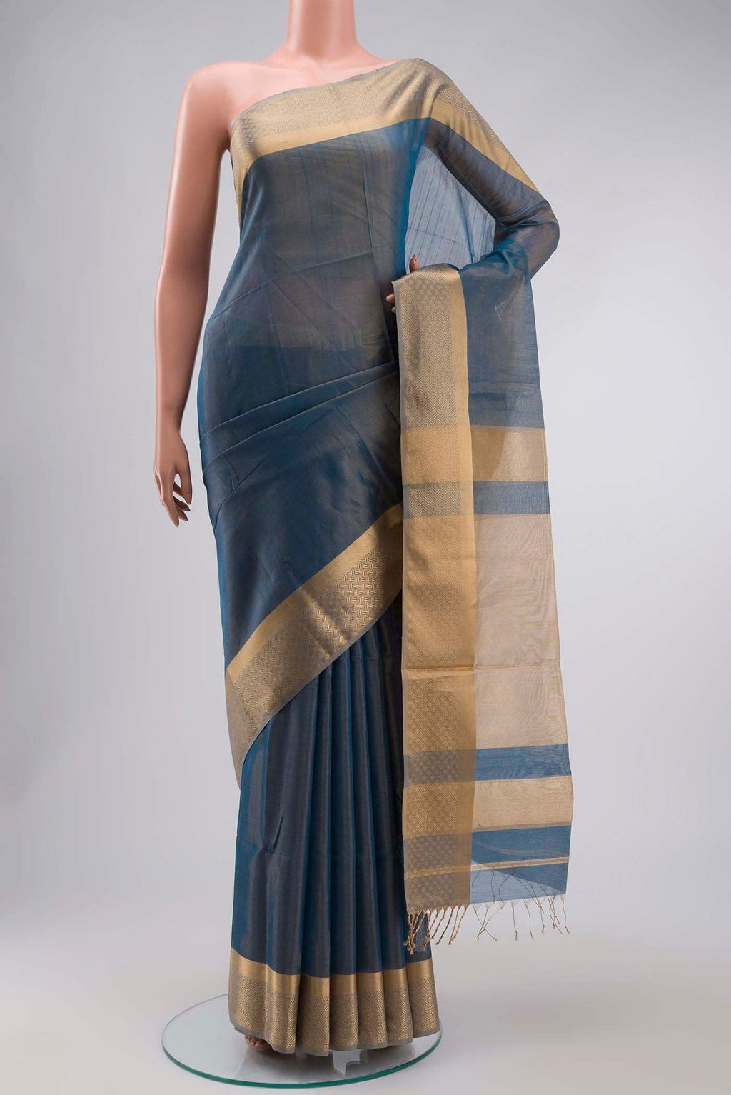Blue Maheshwari Tissue Silk Saree with Plain Body and Zari Border displayed on a mannequin