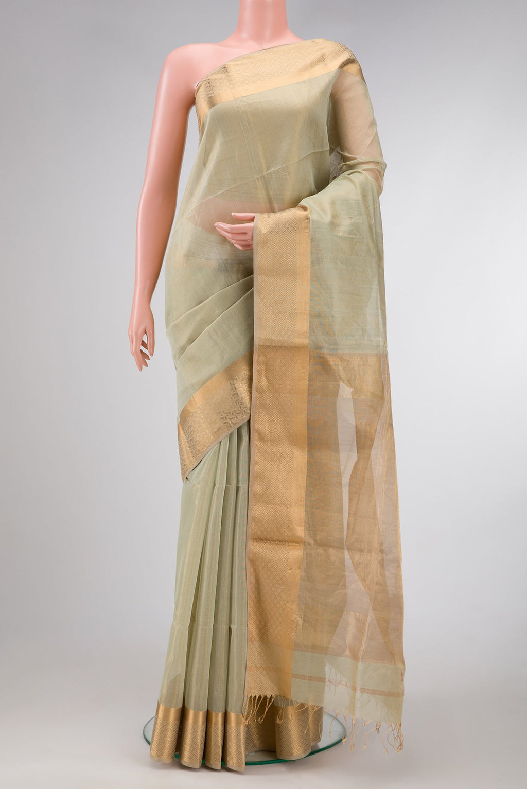 Pista Green Dual Tone Maheshwari Tissue Silk Saree with Plain Body and Zari Border.  displayed on a mannequin