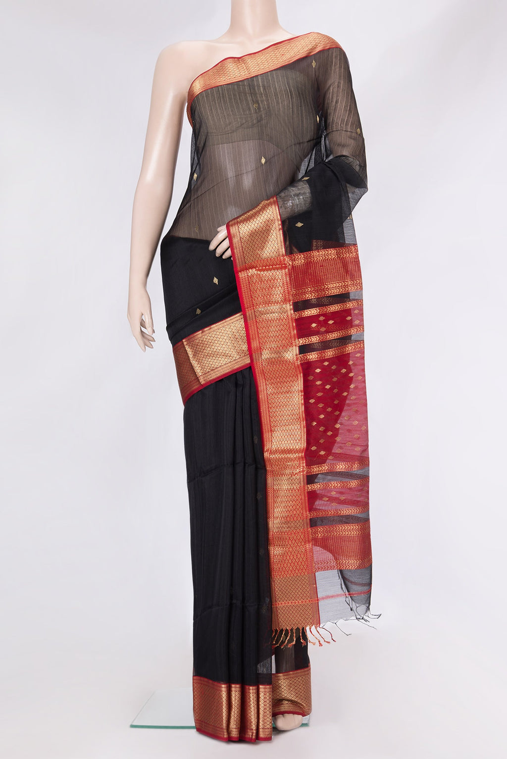 Black Dual Tone Maheshwari Silk Saree with Zari Butta on the body and Zari Border.  displayed on a mannequin
