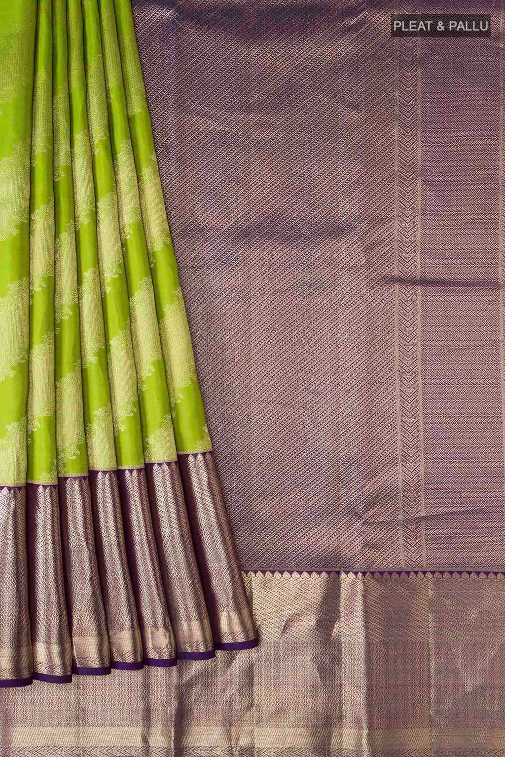 Pleats and pallu of Green Kanchipuram Silk Saree with Zari Butta on the body and Zari Border