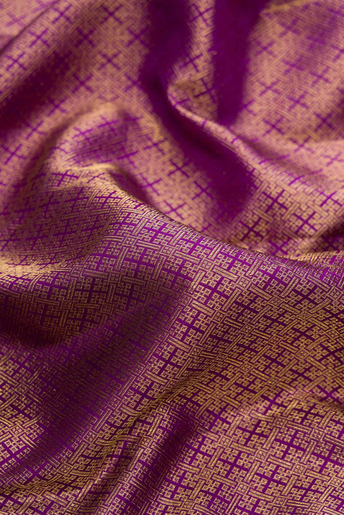 Close up of Purple Dual Tone Kanjivaram Silk Saree with Zari Brocade on the body and Zari Border.  displaying folds