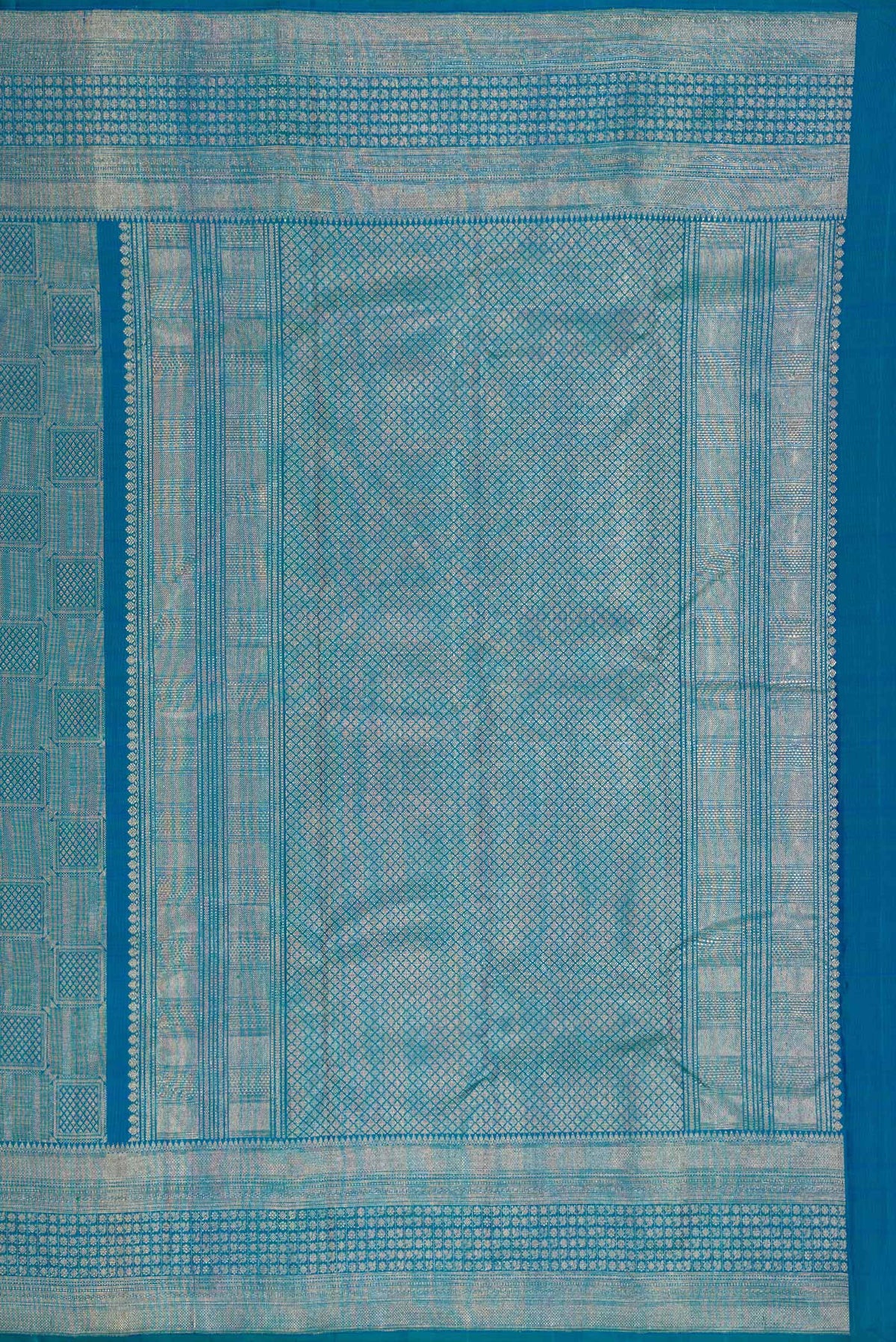 Close up image of the pallu of Peacock Blue Dual Tone Kanchipuram Silk Saree with Zari Brocade on the body and Zari Border. 