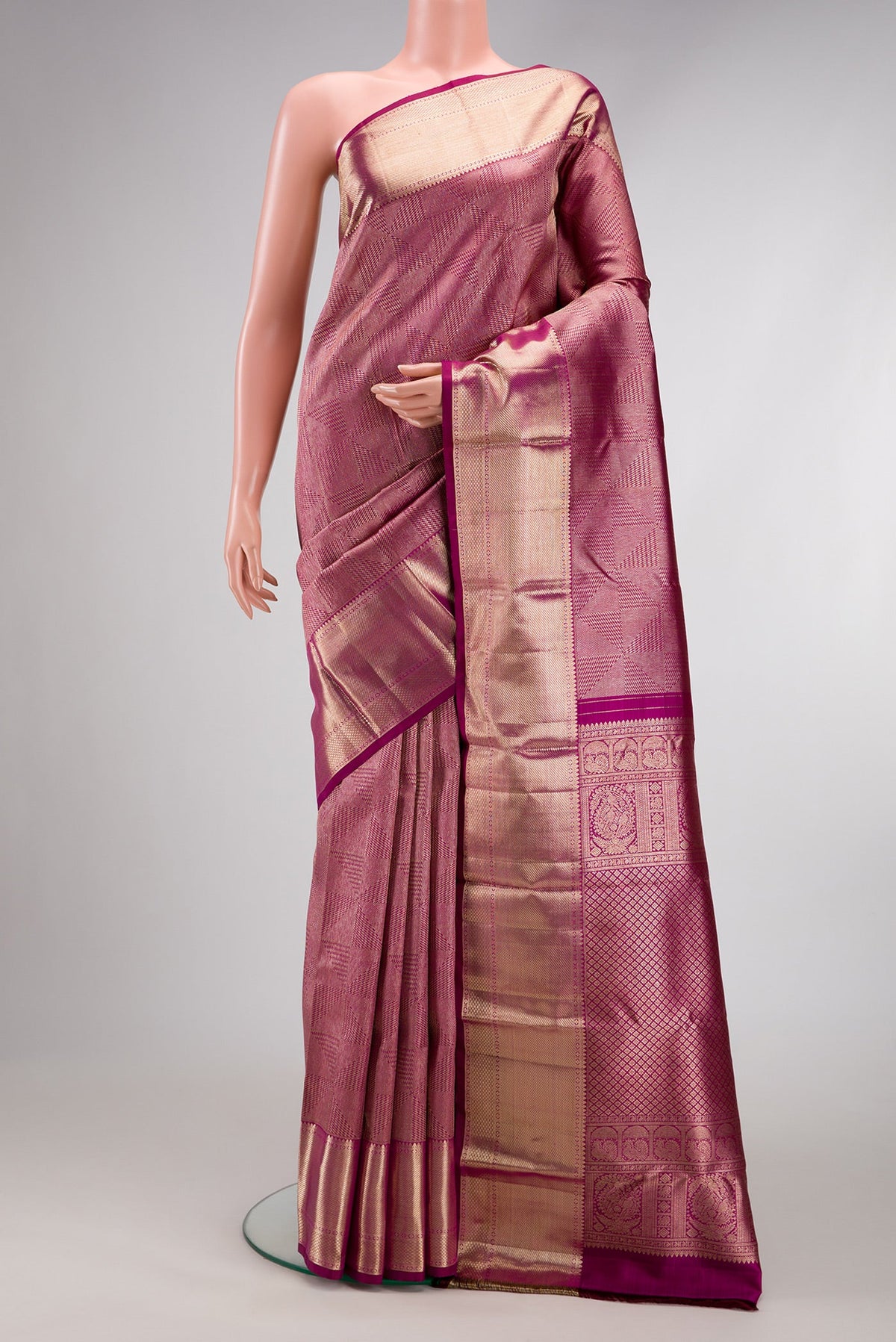 Magenta Dual Tone Kanchipuram Silk Saree with Zari Brocade on the body and Zari Border.  displayed on a mannequin