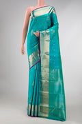 Blue Kanchipuram Silk Saree with Zari Butta on the body and Zari Border displayed on a mannequin