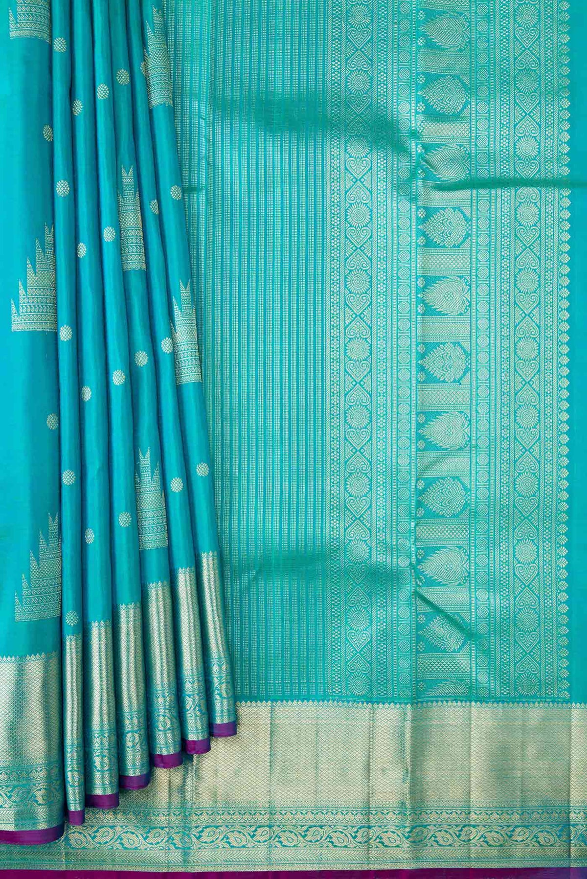 Pleats and pallu of Blue Kanchipuram Silk Saree with Zari Butta on the body and Zari Border
