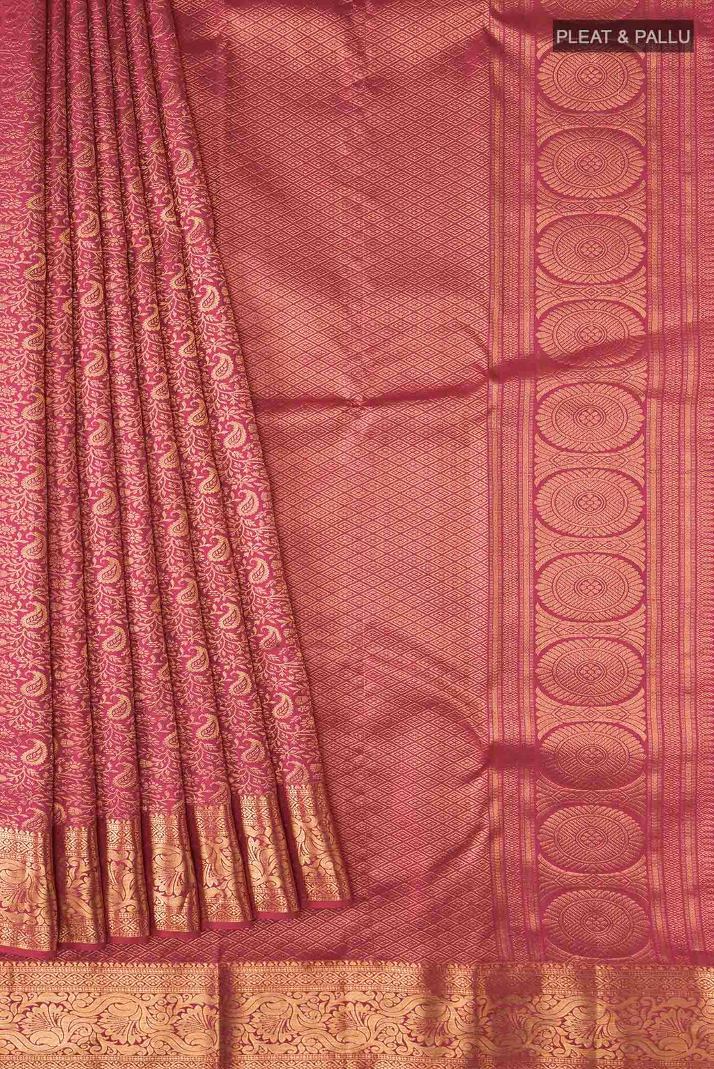Pleats and pallu of Pink Kanchipuram Silk Saree with Zari Brocade on the body and Zari Border