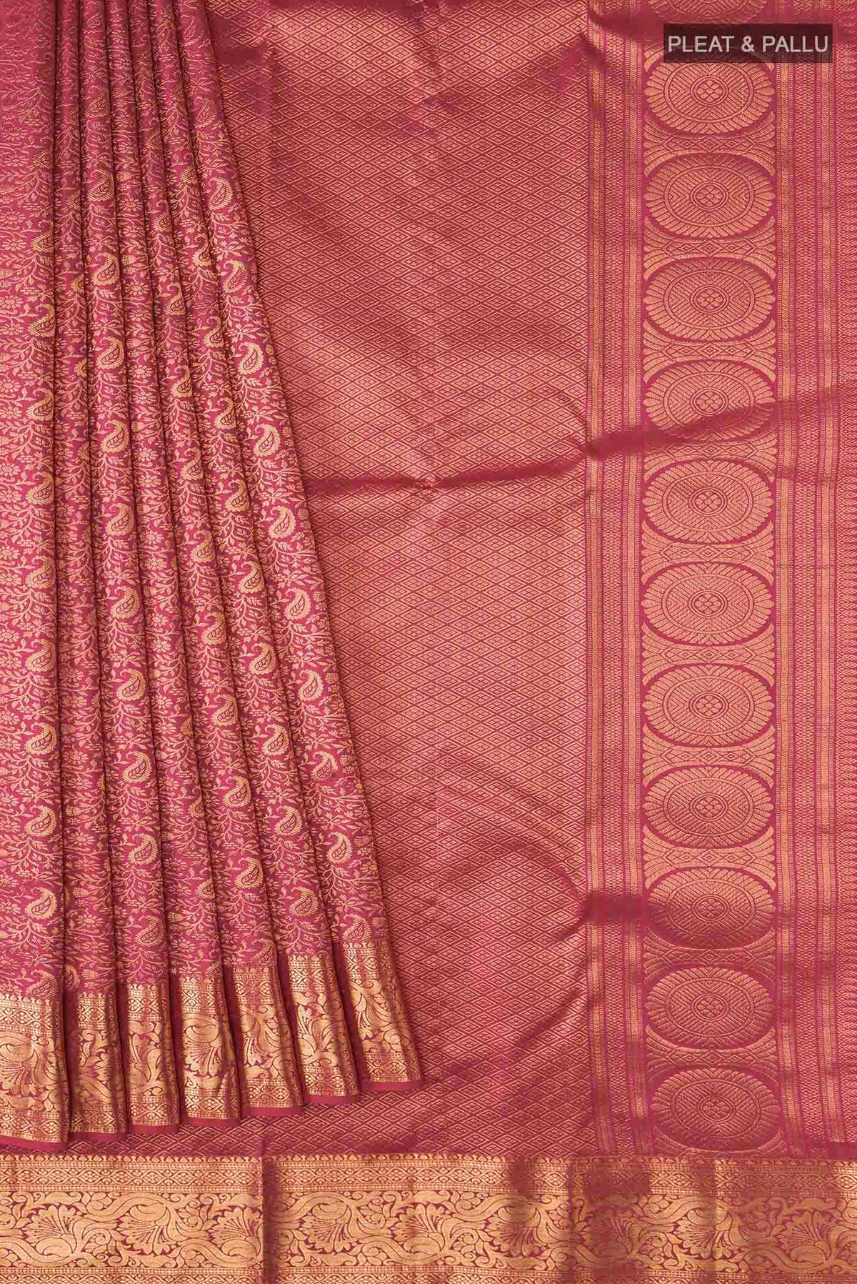 Pleats and pallu of Pink Kanchipuram Silk Saree with Zari Brocade on the body and Zari Border