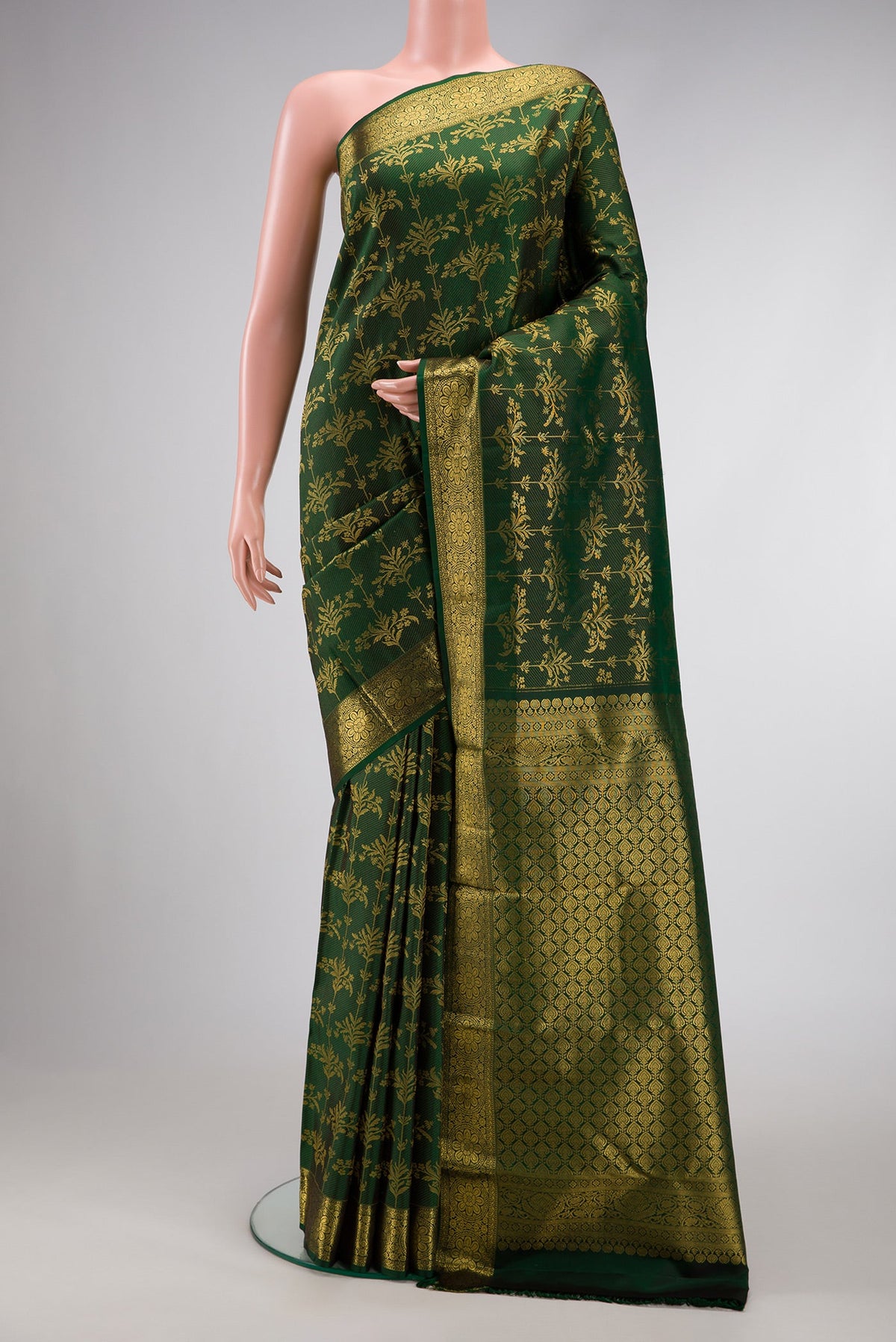 Green Dual Tone Kanjivaram Silk Saree with Zari Brocade on the body and Zari Border.  displayed on a mannequin