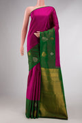 Magenta Kanchipuram Silk Saree with Stripes on the body and One Side Border displayed on a mannequin