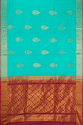 Sky Blue Soft Silk Saree with Zari Butta on the body and Zari Border.  displayed on a mannequin
