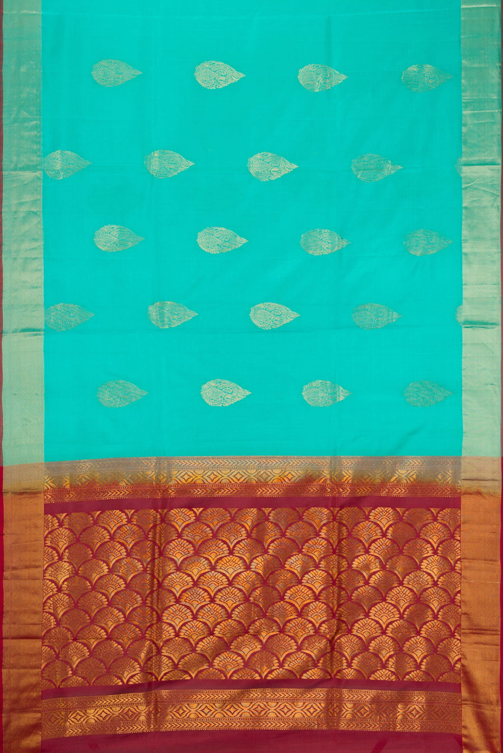 Flat view of Sky Blue Soft Silk Saree with Zari Butta on the body and Zari Border. 