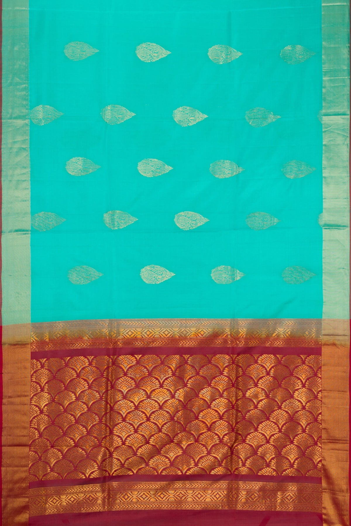 Flat view of Sky Blue Soft Silk Saree with Zari Butta on the body and Zari Border. 
