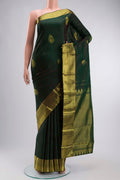 Green Kanchipuram Silk Saree with Zari Butta on the body and Zari Border displayed on a mannequin