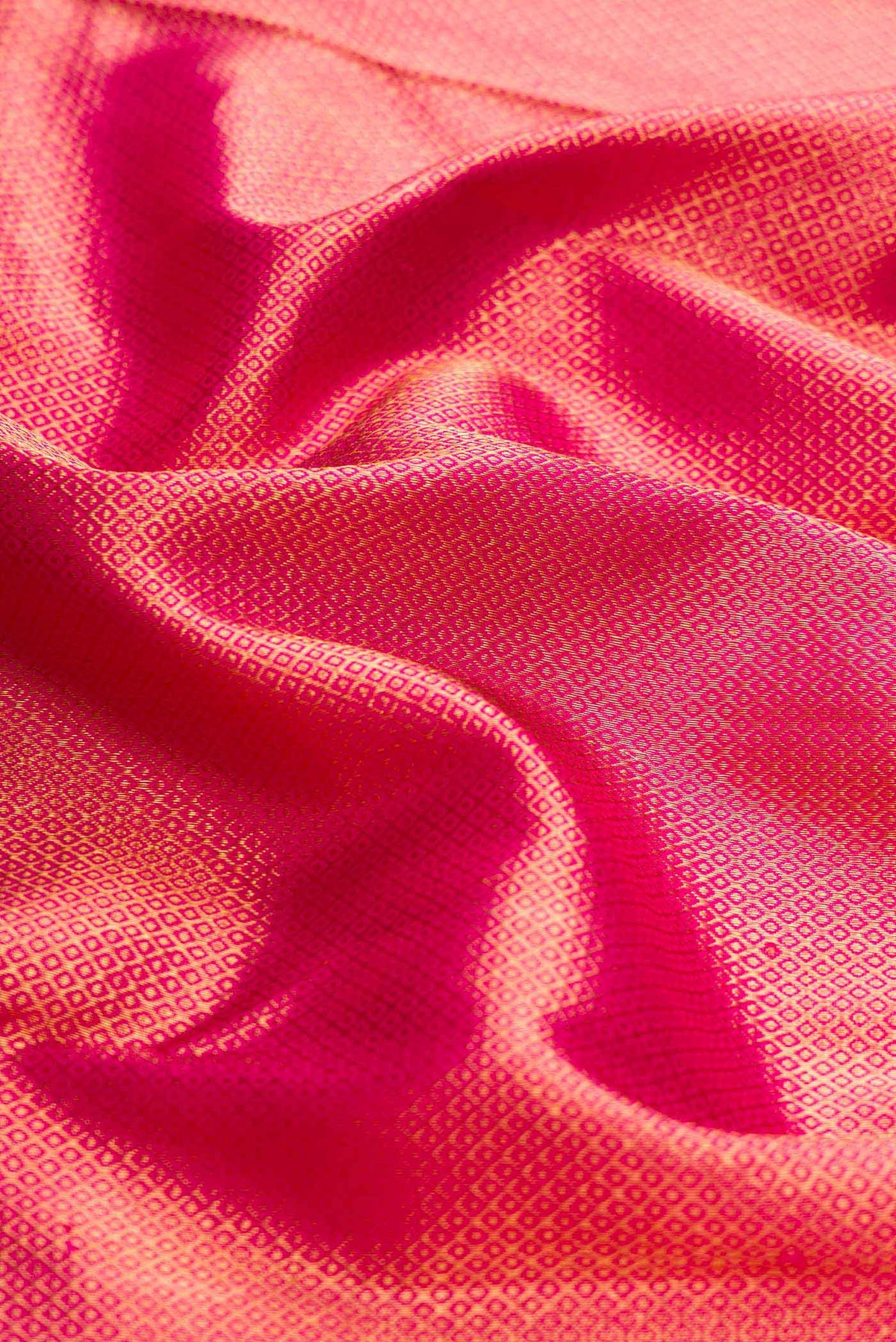 Close up of Pink Dual Tone Kanchipuram Silk Saree with Zari Brocade on the body and Zari Border displaying folds