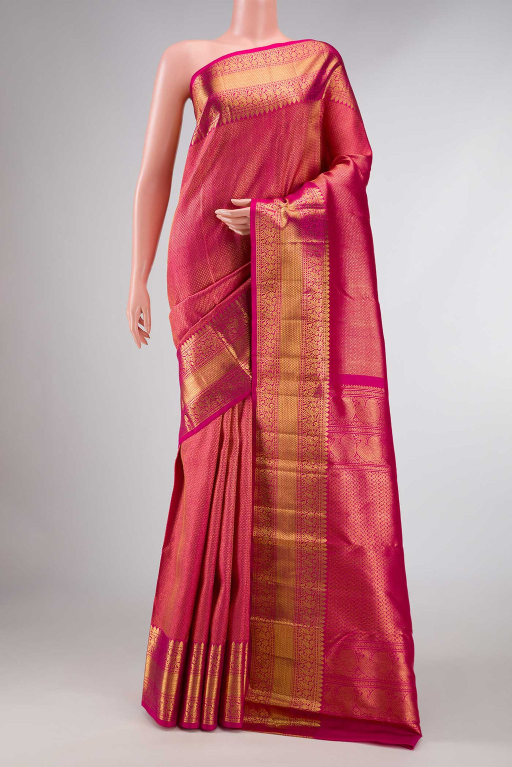 Pink Dual Tone Kanchipuram Silk Saree with Zari Brocade on the body and Zari Border displayed on a mannequin