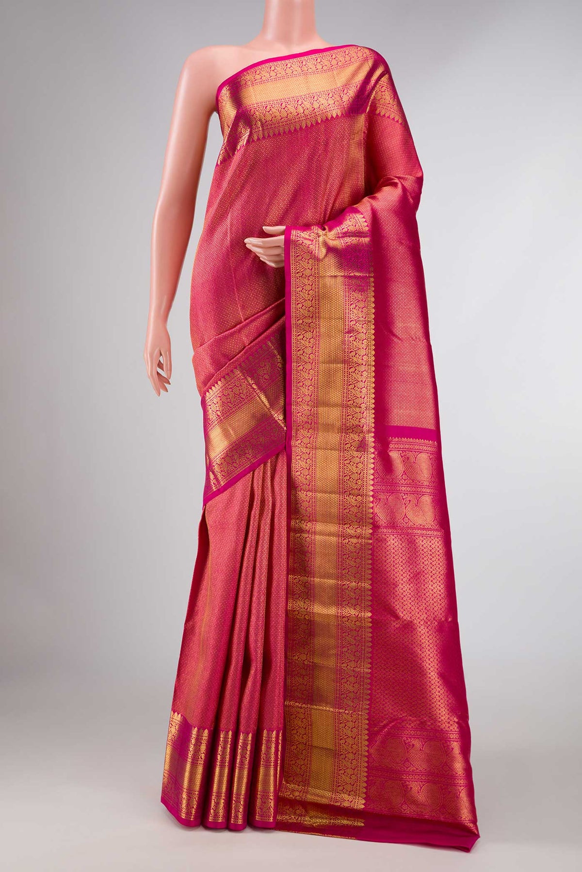 Pink Dual Tone Kanchipuram Silk Saree with Zari Brocade on the body and Zari Border displayed on a mannequin