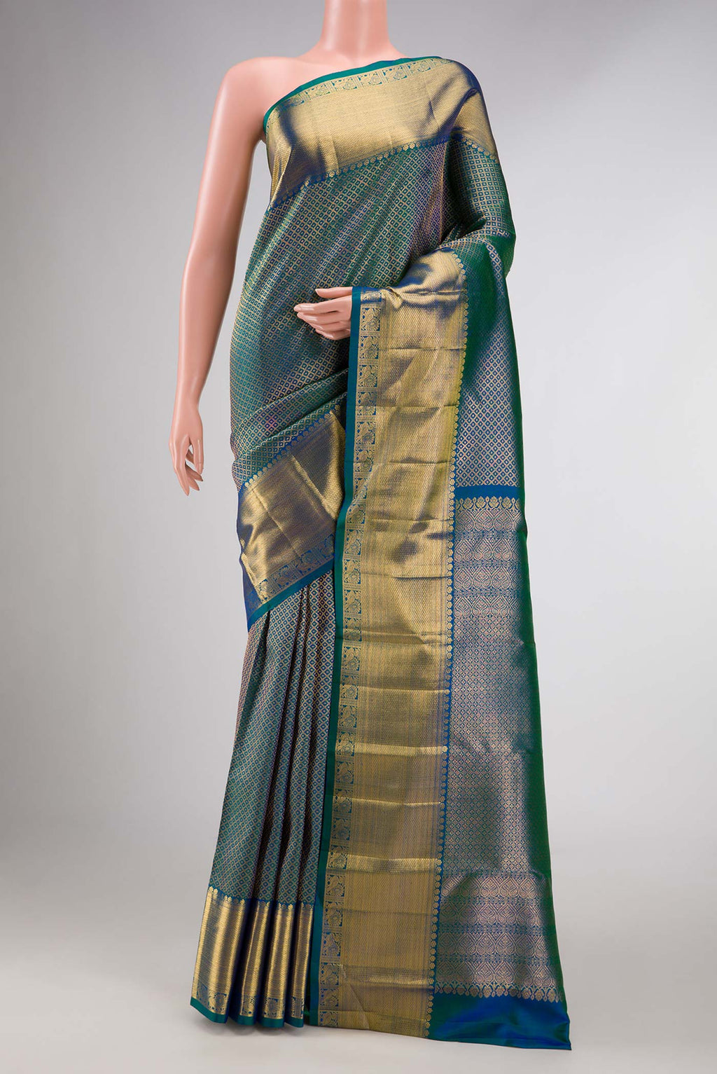 Peacock Blue Dual Tone Kanchipuram Silk Saree with Zari Brocade on the body and Zari Border displayed on a mannequin