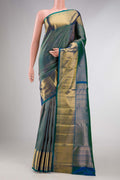Peacock Blue Dual Tone Kanchipuram Silk Saree with Zari Brocade on the body and Zari Border displayed on a mannequin