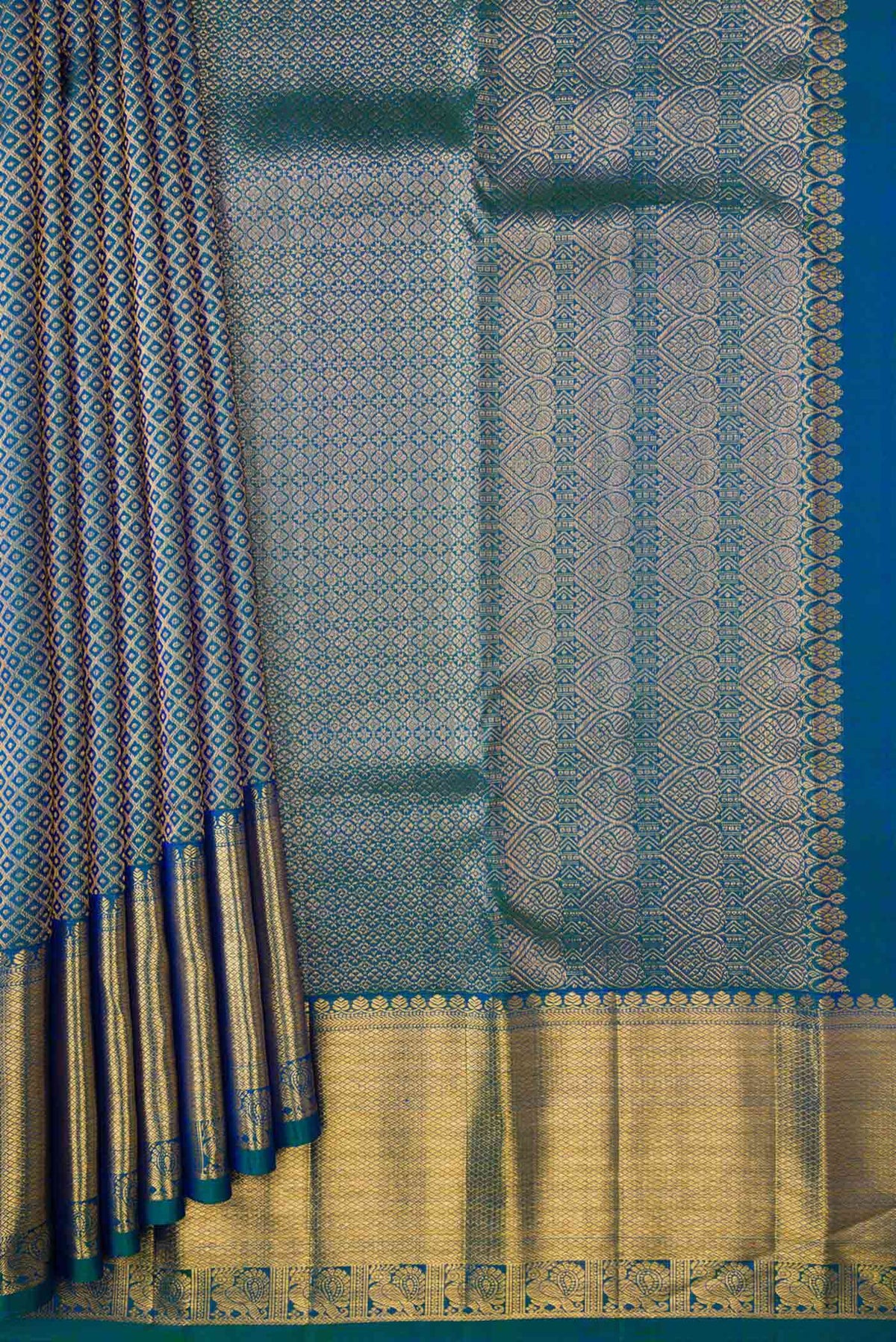 Pleats and pallu of Peacock Blue Dual Tone Kanchipuram Silk Saree with Zari Brocade on the body and Zari Border