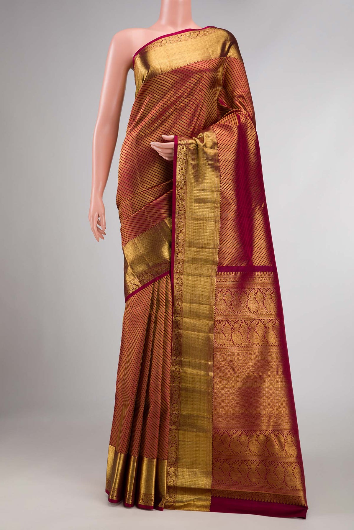 Maroon Dual Tone Kanchipuram Saree with Zari Brocade on the body and Zari Border displayed on a mannequin