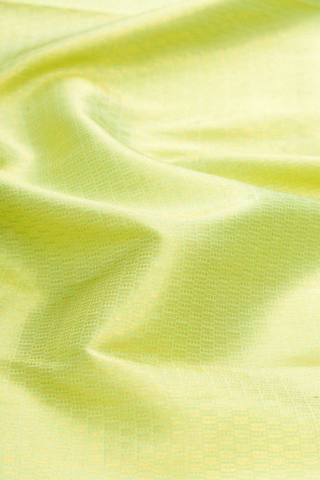 Close up of Green Kanchipuram Silk Saree with Zari Brocade on the body and Zari Border displaying folds
