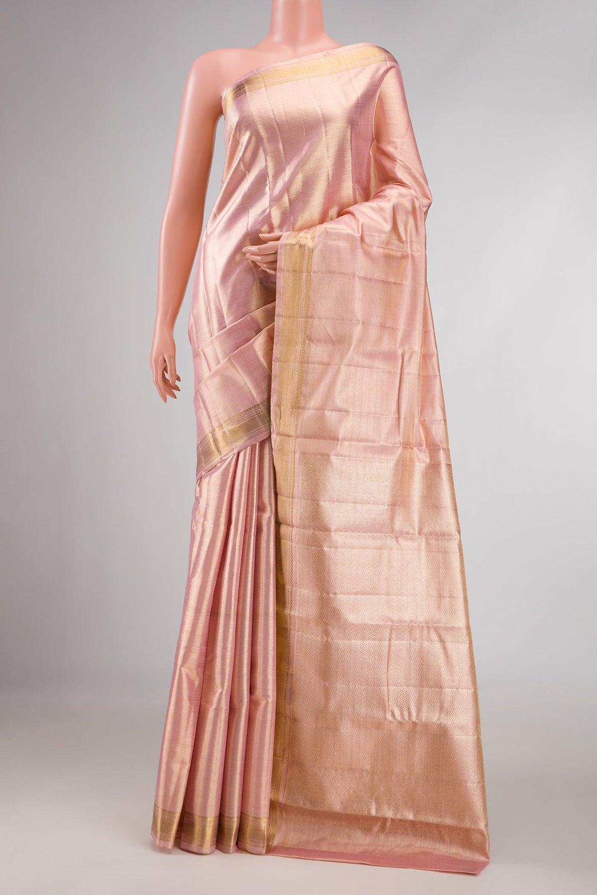 Pink Dual Tone Kanchipuram Saree with Jacquard design on the body and Zari Border displayed on a mannequin