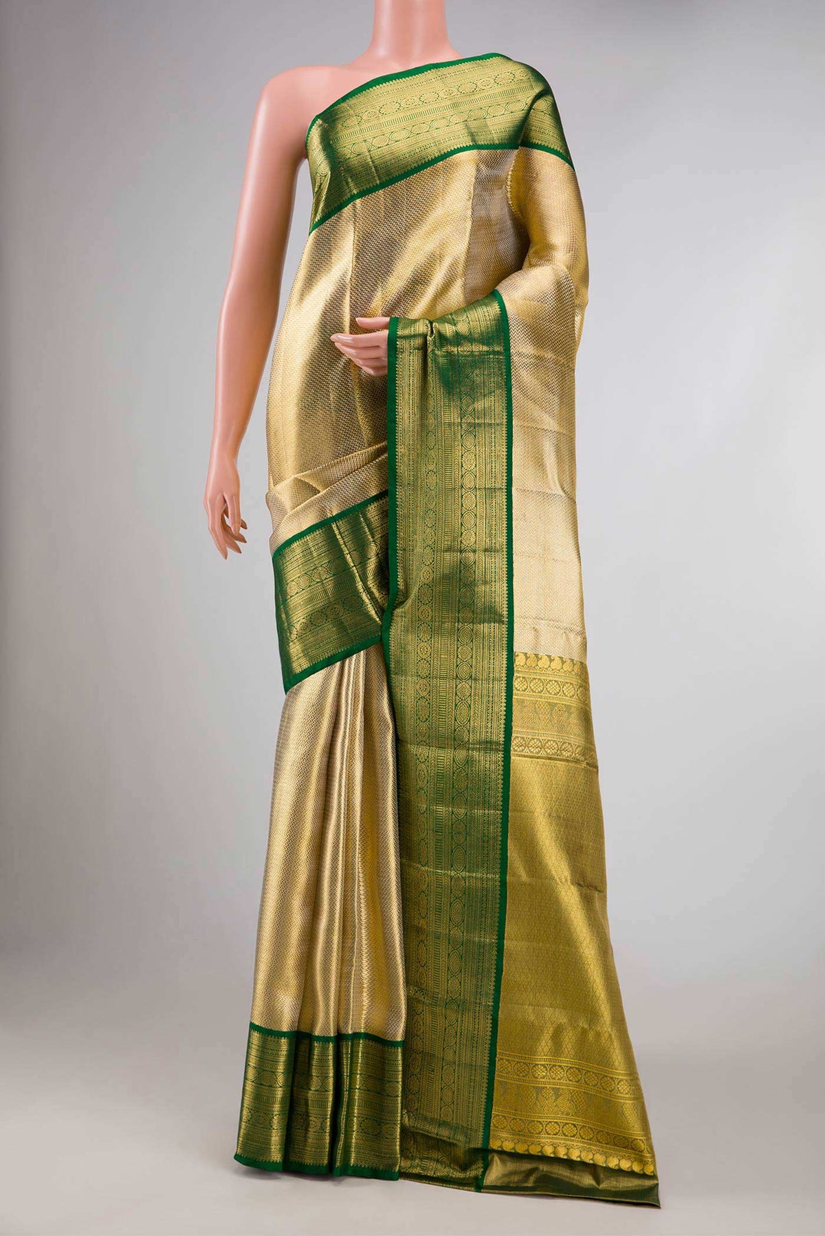 Gold Dual Tone Kanchipuram Tissue Silk Saree with Zari Brocade on the body and Zari Border displayed on a mannequin