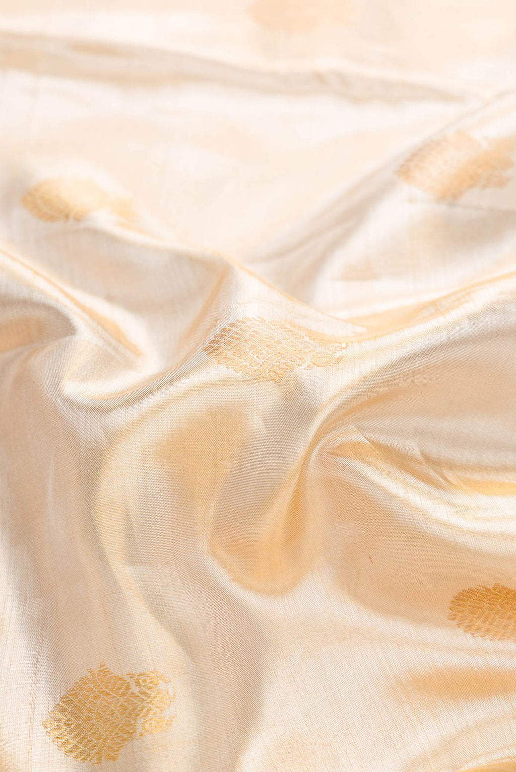 Close up of Sandal Dual Tone Kanchipuram Tissue Silk Saree with Zari Brocade on the body and Zari Border displaying folds