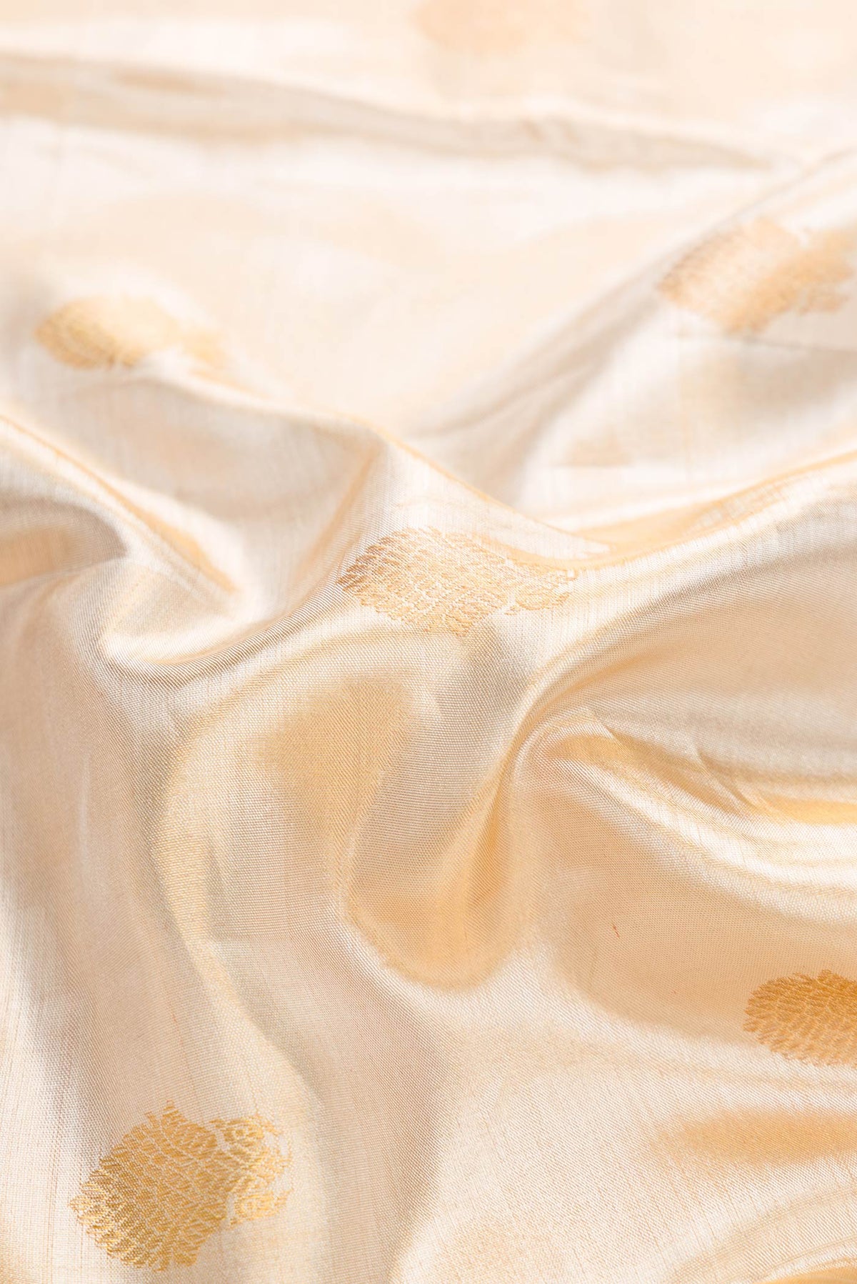 Close up of Sandal Dual Tone Kanchipuram Tissue Silk Saree with Zari Brocade on the body and Zari Border displaying folds