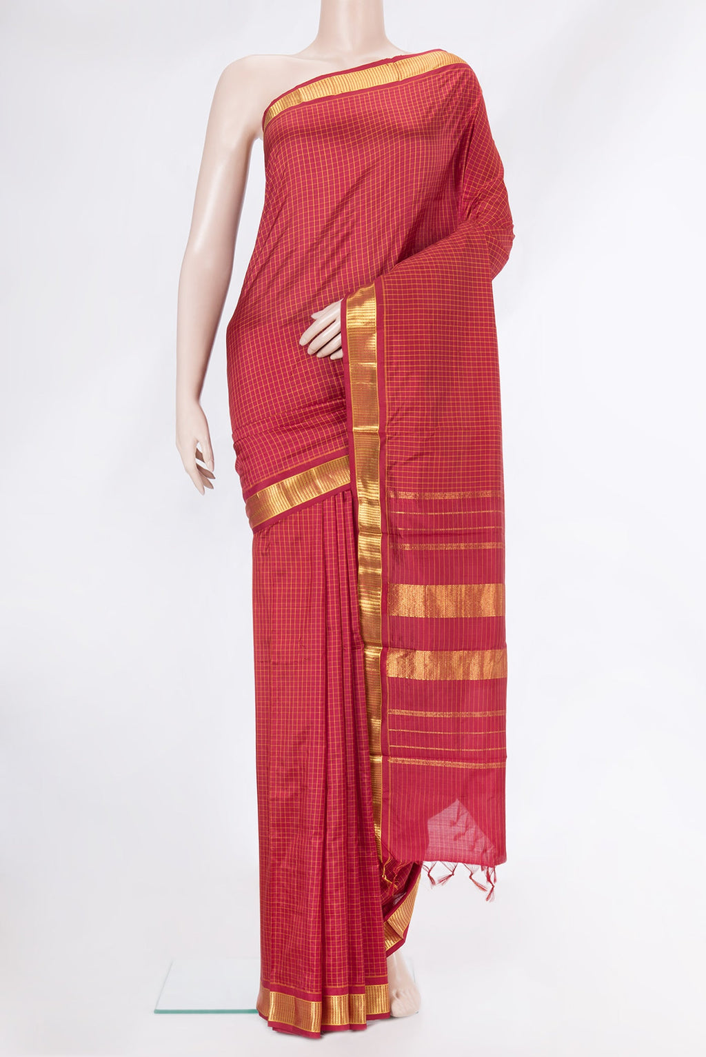Maroon Kanchipuram Silk Saree with Checked design on the body and Zari Border.  displayed on a mannequin