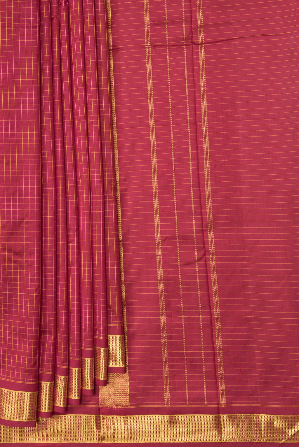 Pleats and pallu of Maroon Kanchipuram Silk Saree with Checked design on the body and Zari Border. 