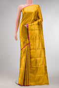 Gold Dual Tone Kanchipuram Tissue Silk Saree with Zari Brocade on the body and Zari Border.  displayed on a mannequin