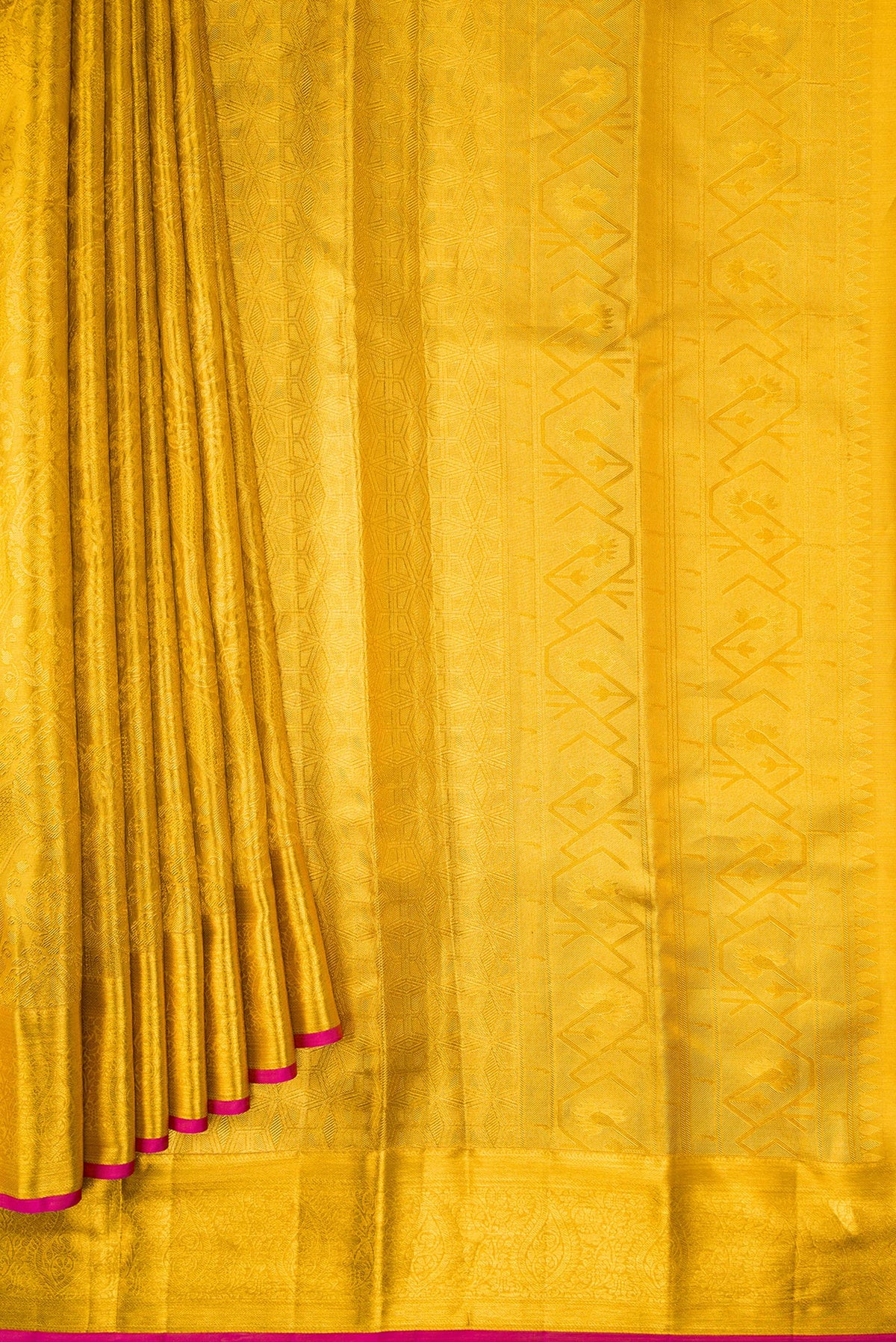 Pleats and pallu of Gold Dual Tone Kanchipuram Tissue Silk Saree with Zari Brocade on the body and Zari Border. 