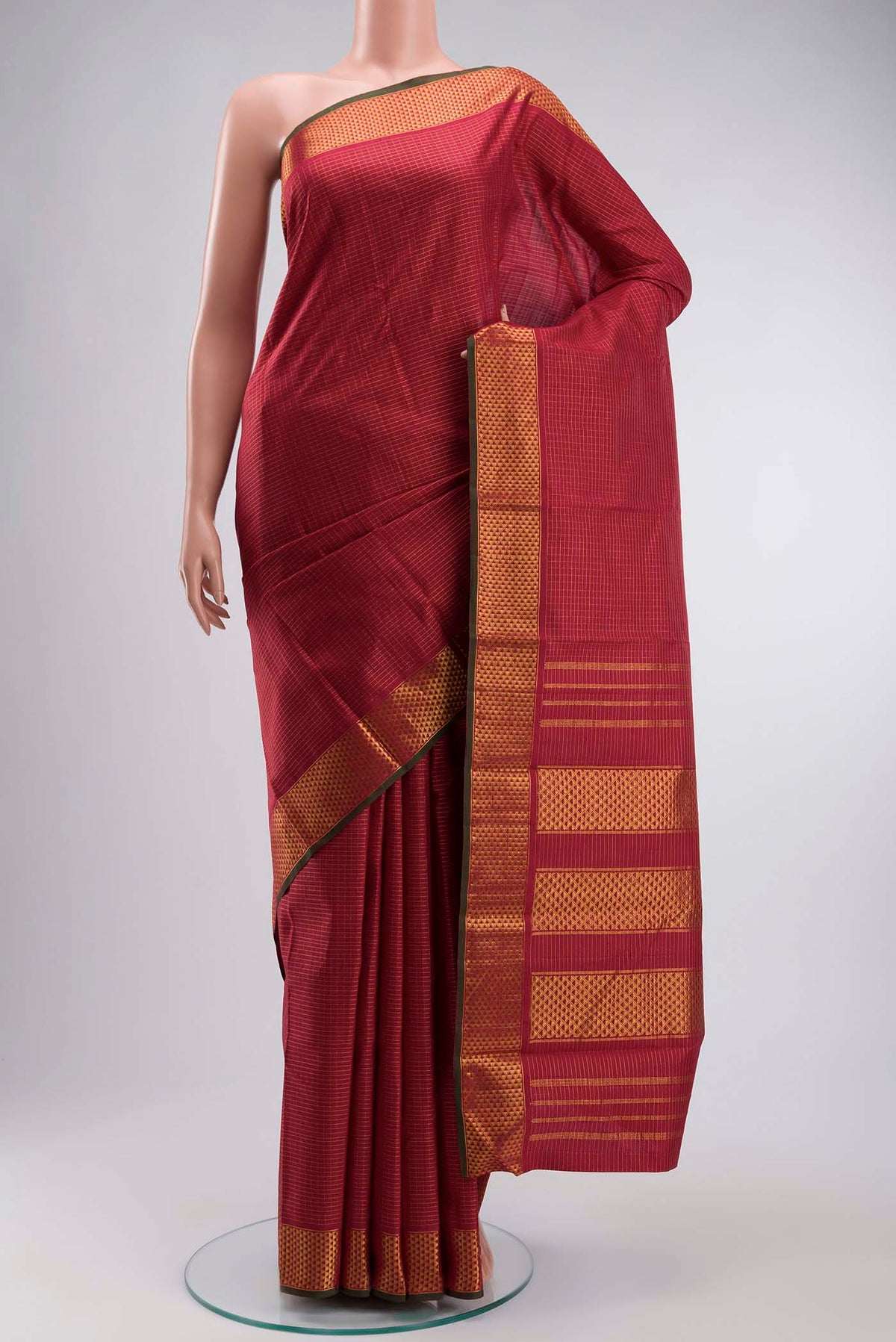 Maroon Kanchipuram Silk Saree with Checked design on the body and Zari Border displayed on a mannequin
