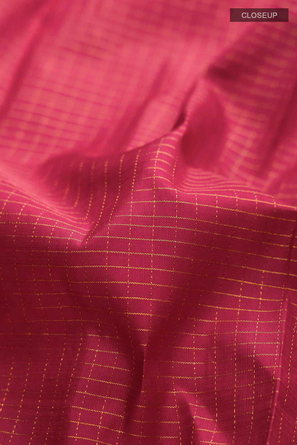 Close up of Maroon Kanchipuram Silk Saree with Stripes on the body and Zari Border displaying folds