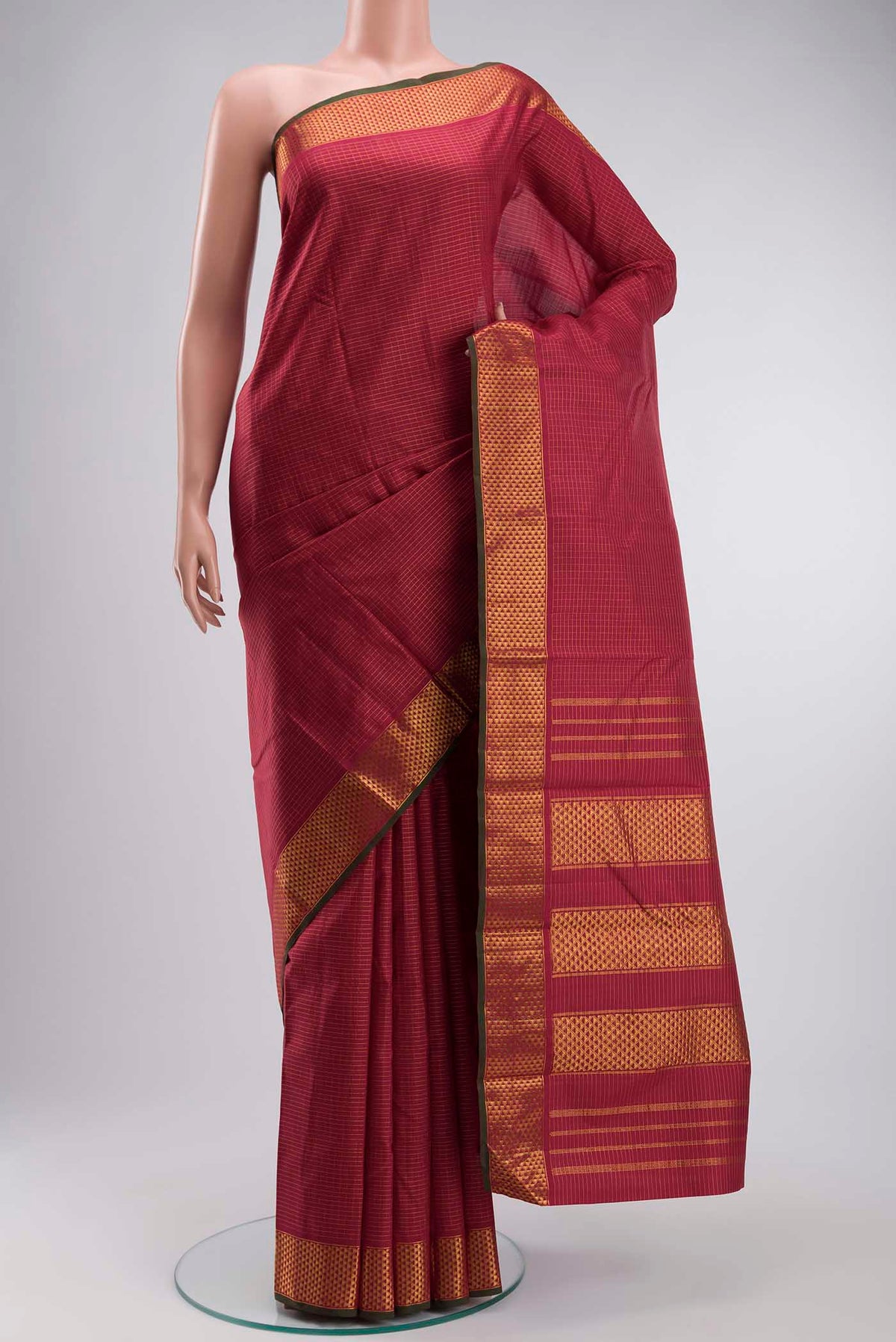 Maroon Kanchipuram Silk Saree with Stripes on the body and Zari Border displayed on a mannequin
