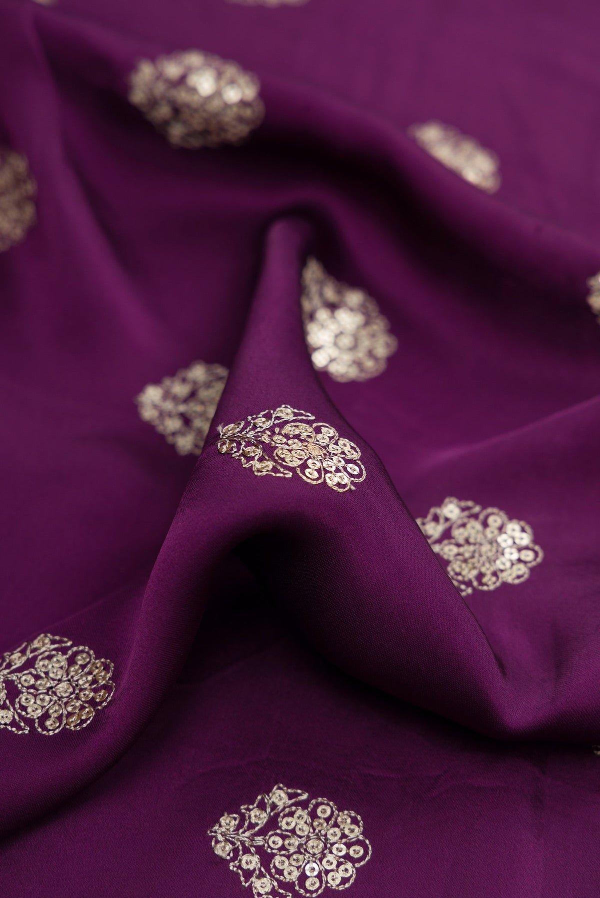 Close up of Purple Dual Tone Crepe Saree with Embroidery on the body and Embroidery Border.  displaying folds