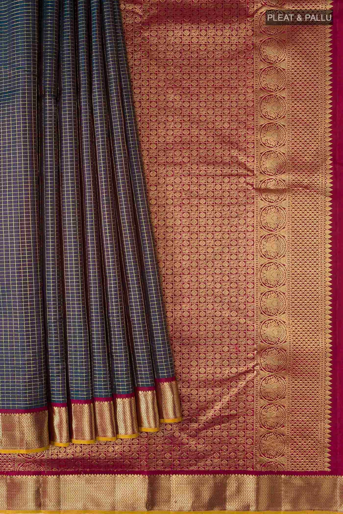 Pleats and pallu of Blue Kanchipuram Silk Saree with Checked design on the body and Zari Border