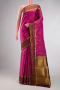 Pink Dual Tone Kanchipuram Silk Saree with Zari Butta on the body and Zari Border displayed on a mannequin