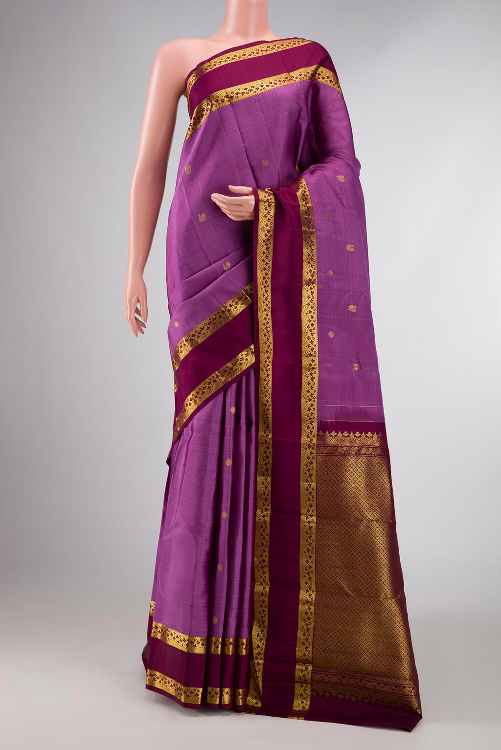 Lavender Dual Tone Kanchipuram Silk Saree with Zari Butta on the body and Zari Border displayed on a mannequin
