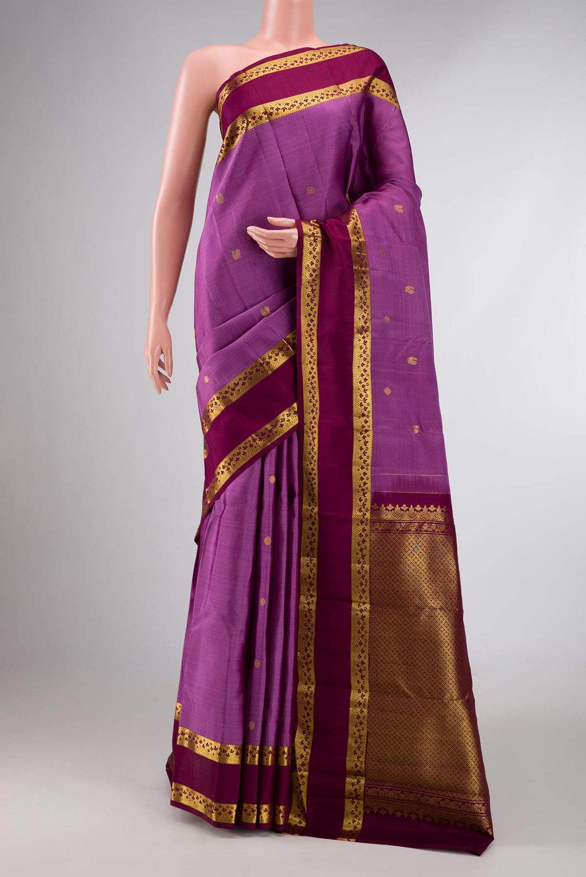 Lavender Dual Tone Kanchipuram Silk Saree with Zari Butta on the body and Zari Border displayed on a mannequin