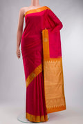 Pink Kanchipuram Silk Saree with Jacquard design on the body and Zari Border displayed on a mannequin