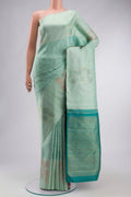 Green Kanchipuram Silk Saree with Jacquard design on the body and Zari Border displayed on a mannequin