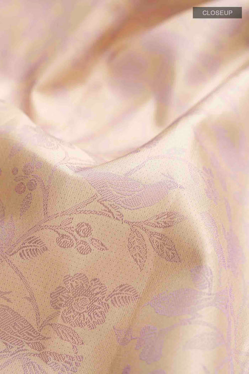 Close up of Beige Kanchipuram Silk Saree with Jacquard design on the body and Zari Border displaying folds