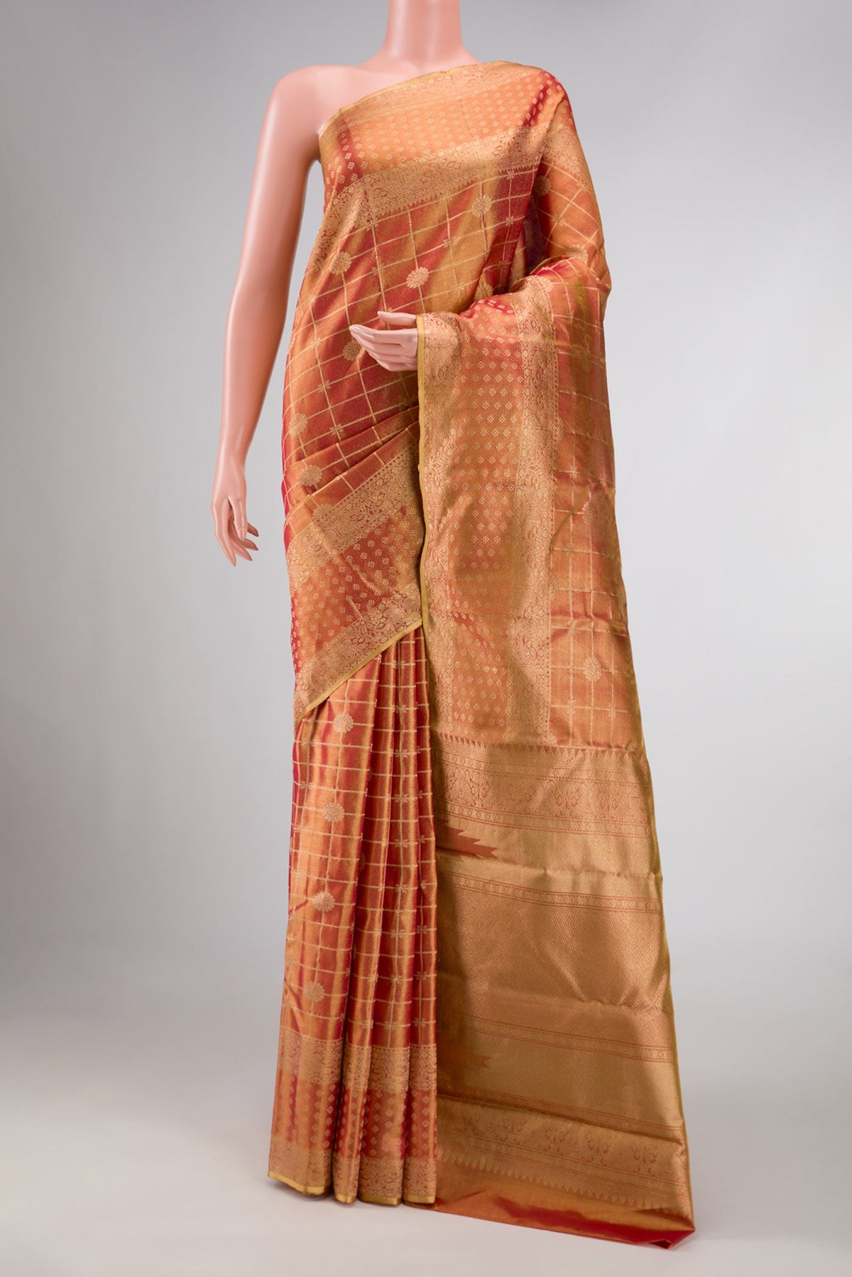 Dark Pink Dual Tone Kanchipuram Tissue Silk Saree with Zari Brocade on the body and Zari Border displayed on a mannequin