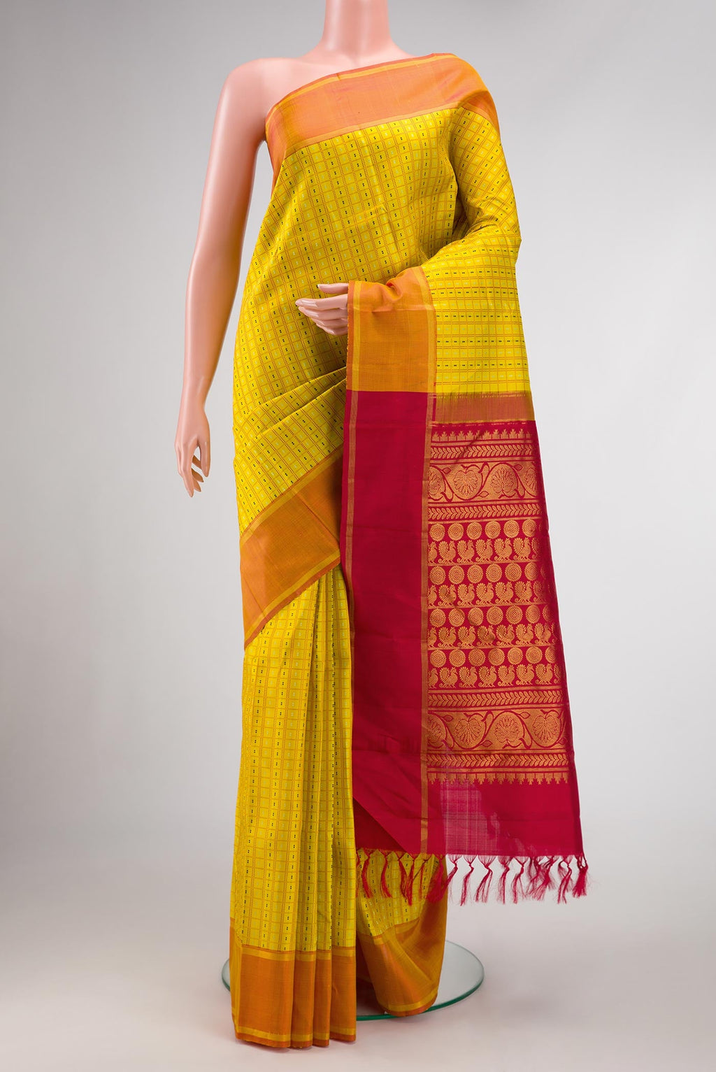 Yellow Dual Tone Kanchipuram Silk Saree with Checked design on the body and Zari Border.  displayed on a mannequin